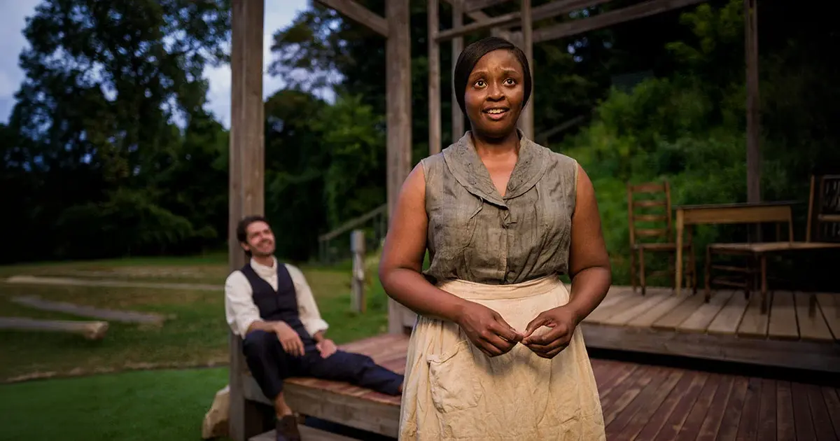 Actors standing on an outdoor stage